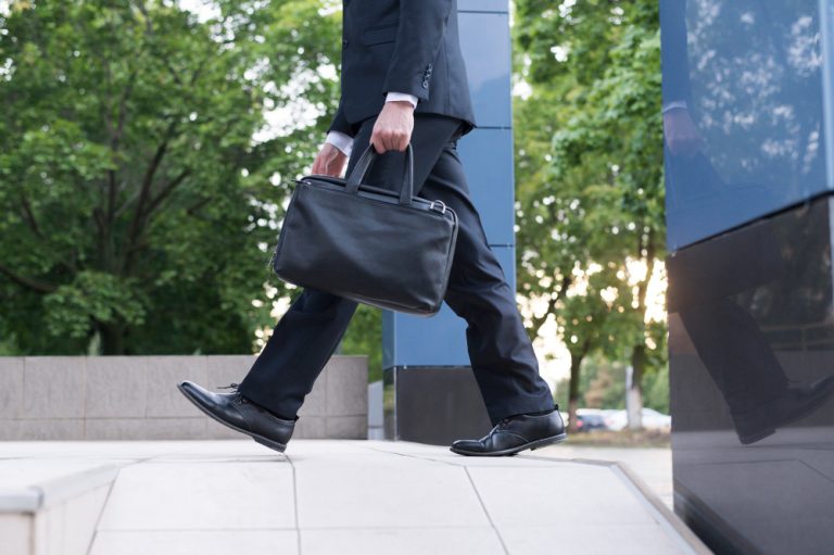 Side view of man with handbag
