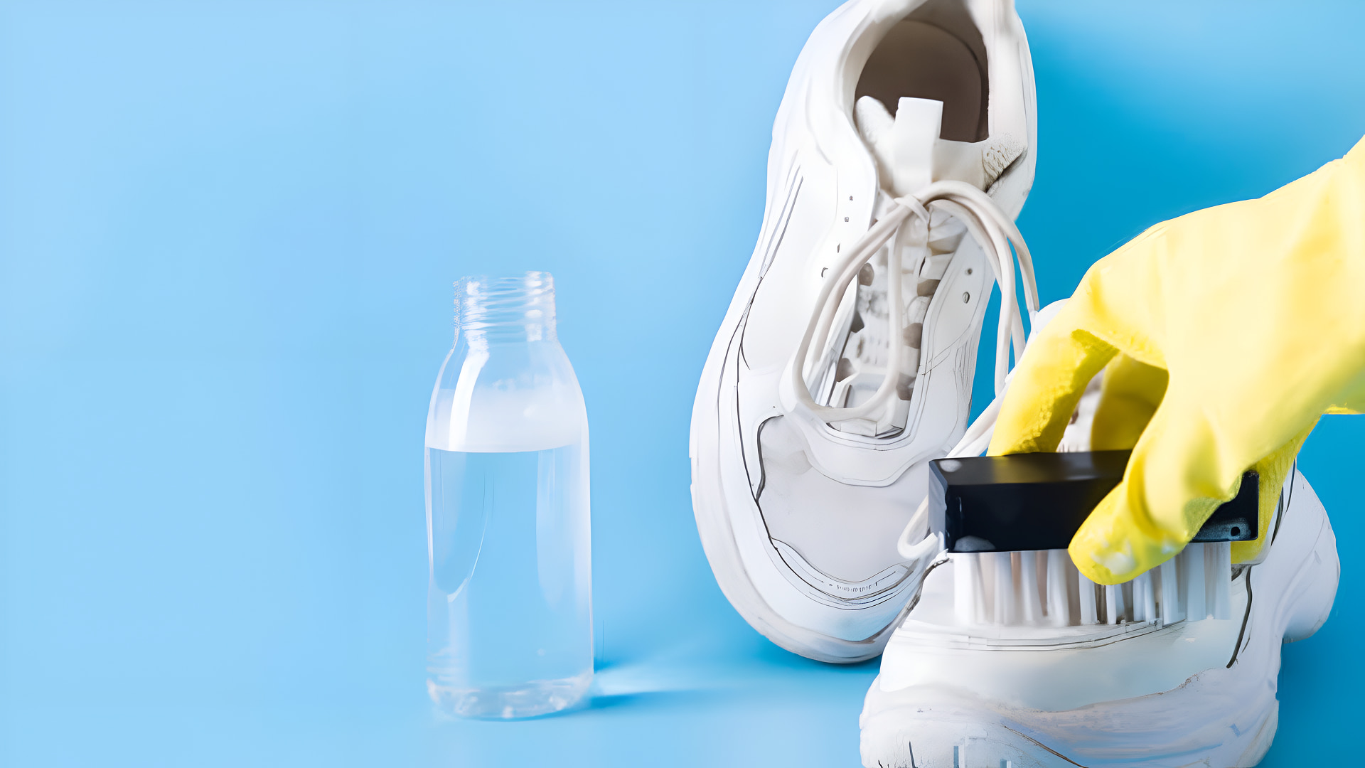 Cleaning white sneakers with a brush.