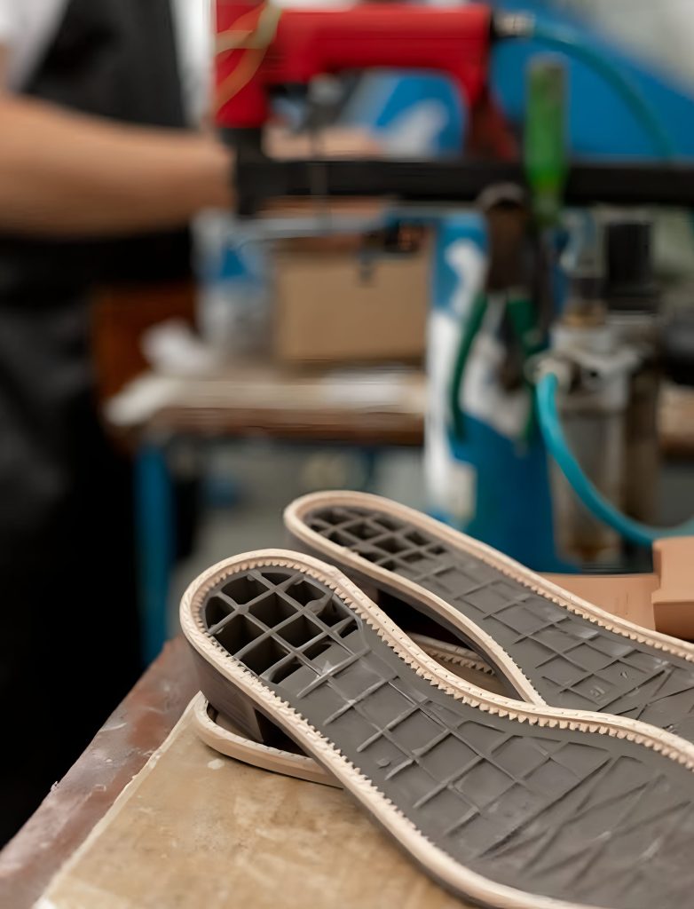 Shoe Soles on a Wooden Surface in Close-up Photography